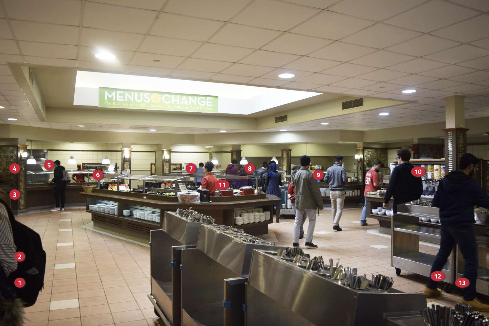 An image of students grabbing food from the Busch Dining Hall food stations