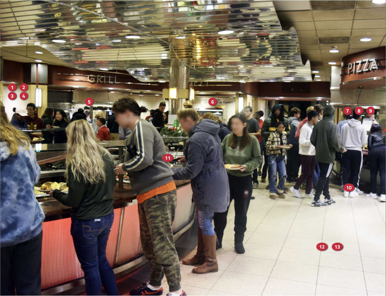 An image of students grabbing food from the Neilson Dining Hall food stations